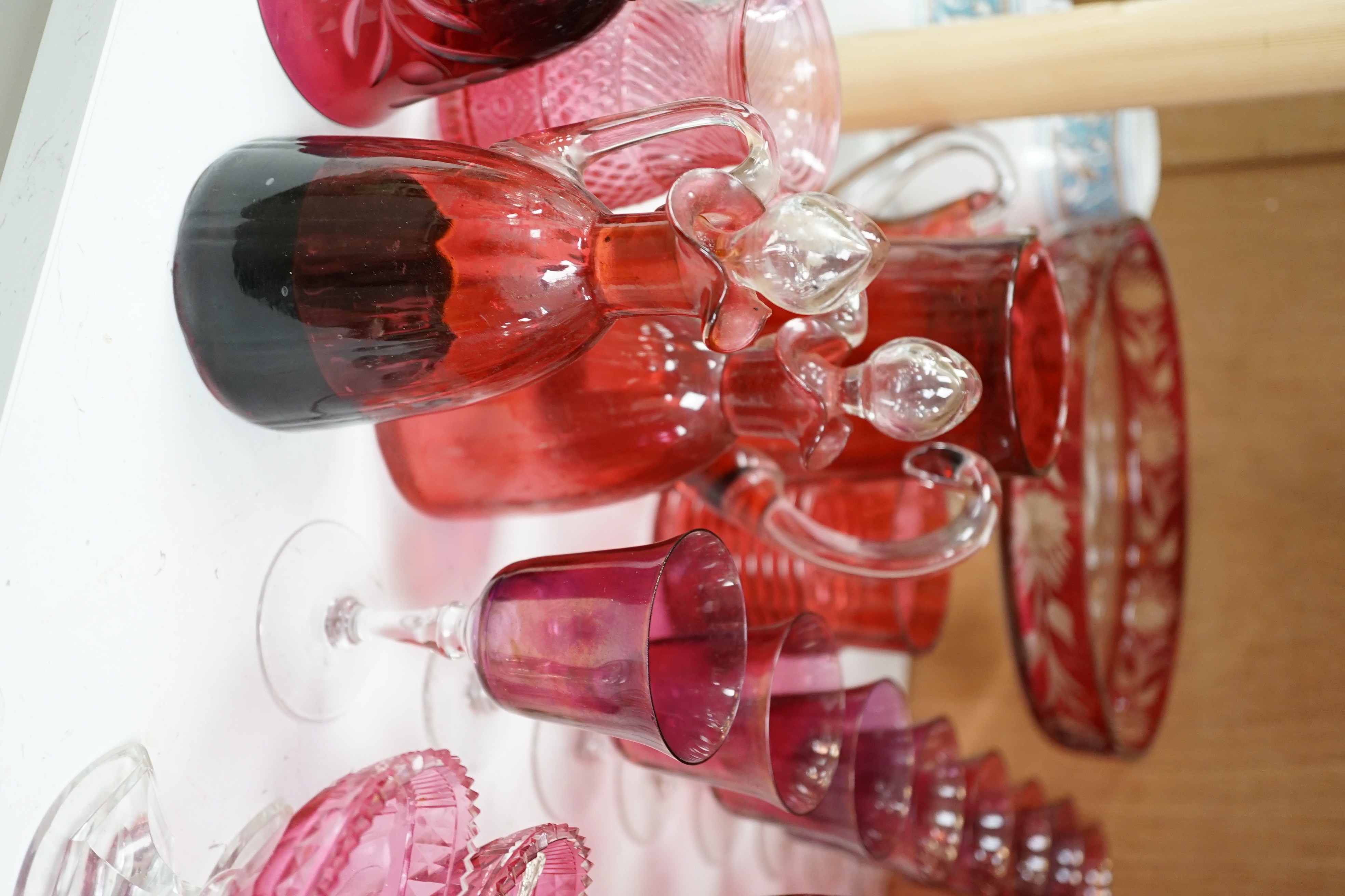 Red glasswares and six various cranberry coloured glass jugs, etc. 19th/early 20th century